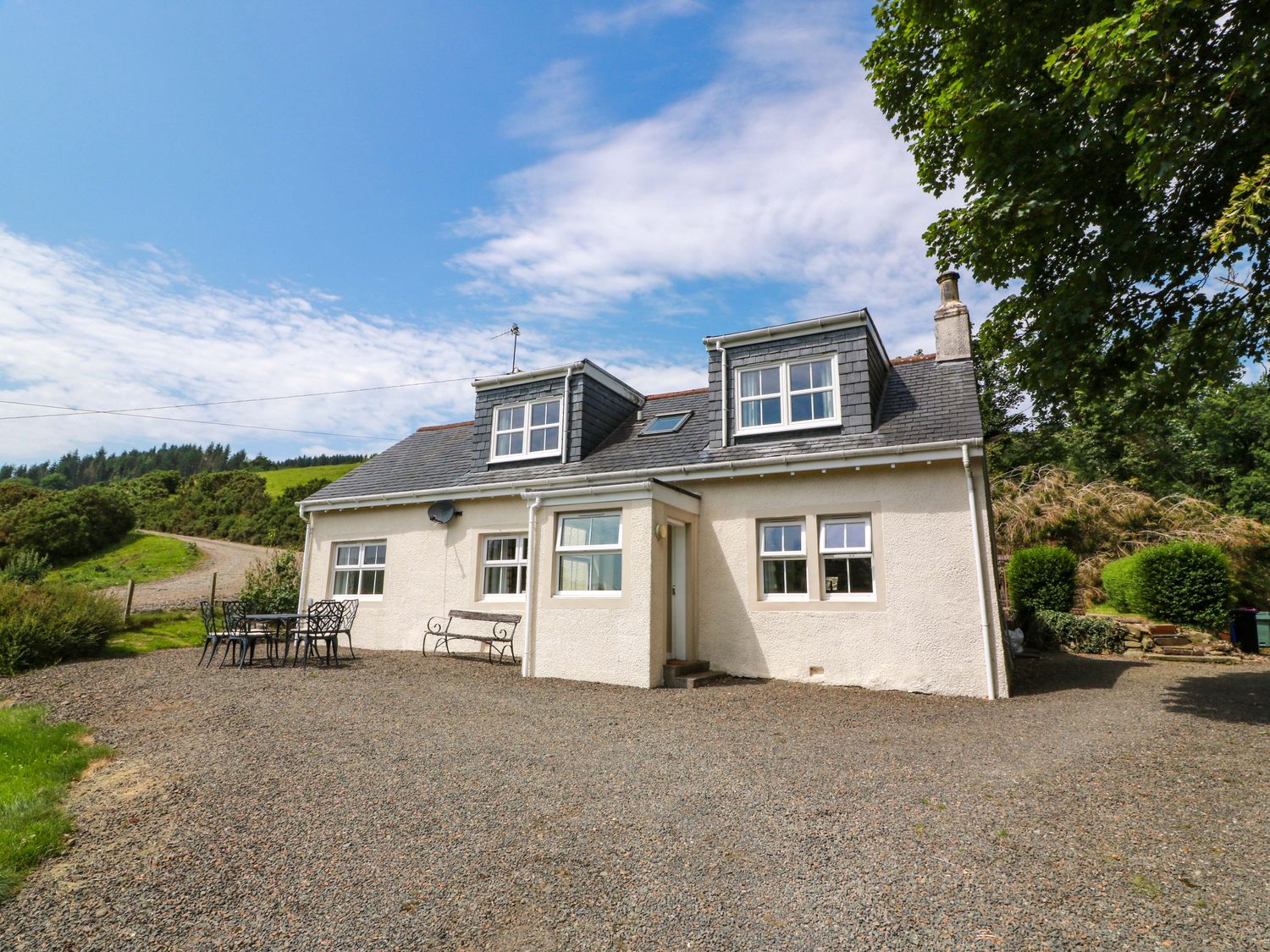 A house with windows and a gravel driveway at Cairnhill in Girvan