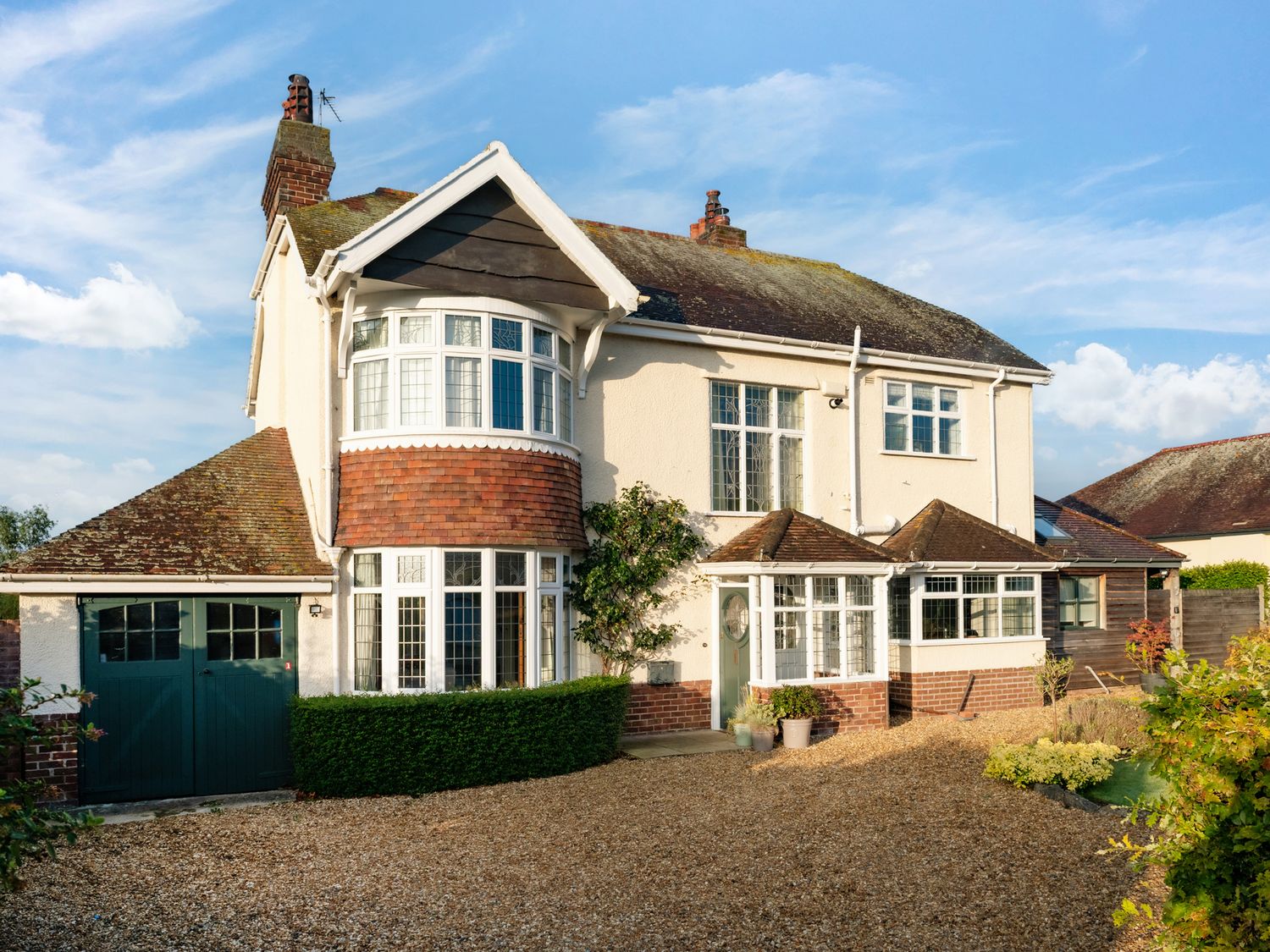 A house with a front yard and garage at Summerfield in Deganwy