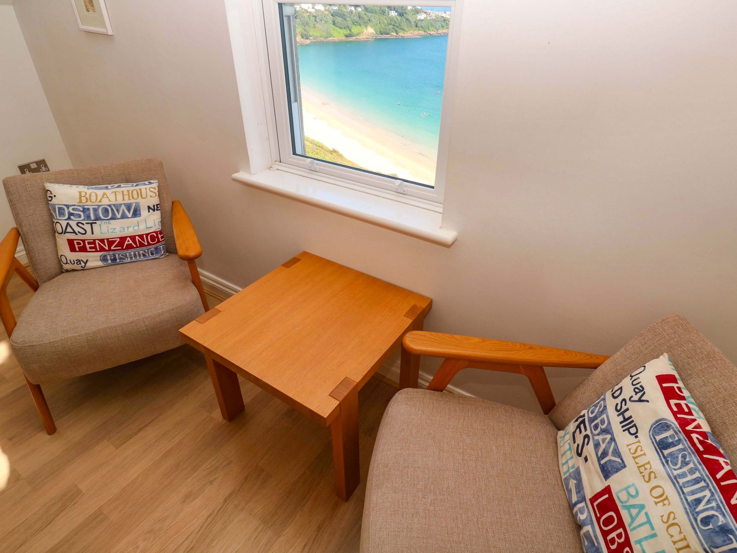 A snug with two chairs and a table at Meridian in Carbis Bay