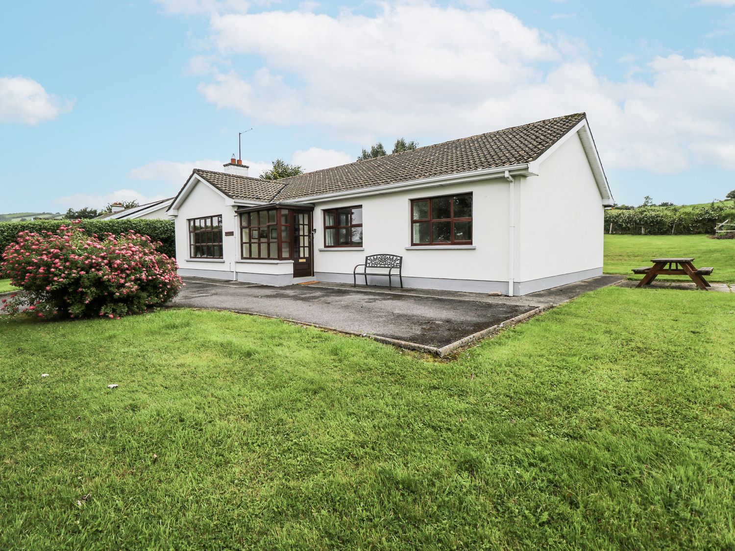 A house with a bench and garden at Brow O' The Hill in Ballyshannon