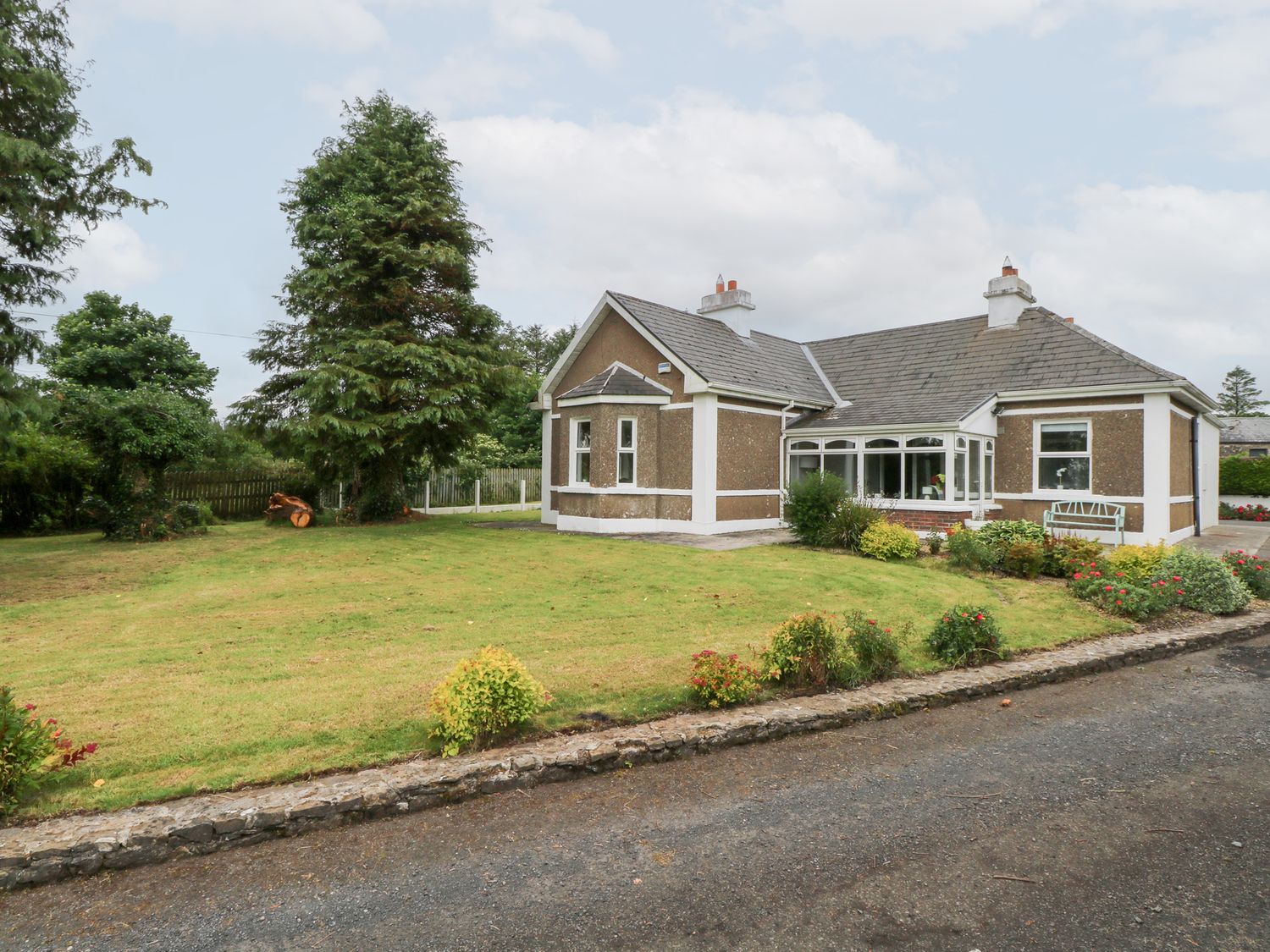 A house with a garden and trees at Churchfield House in Moygownagh near Crossmolina, County Mayo