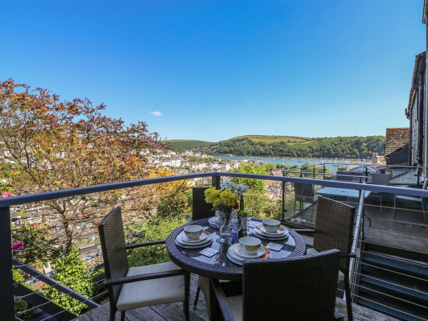 An outdoor patio with a table set for dining at 46 Crowthers Hill Dartmouth