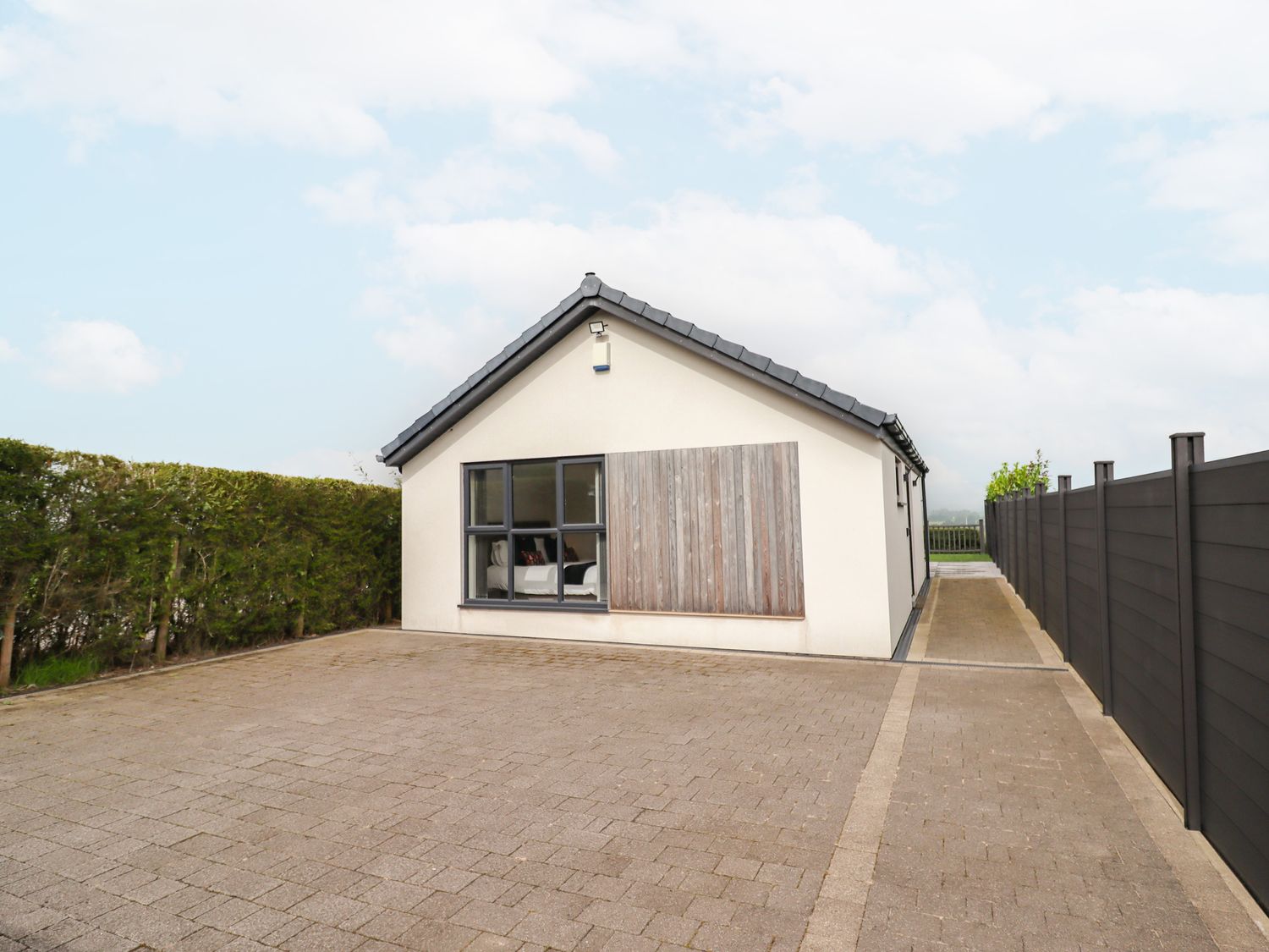 A house with a driveway and fence at View@Langho, Langho, Lancashire