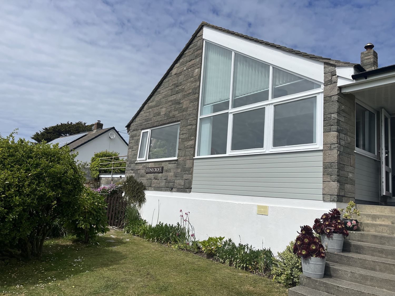 A house with windows and plants at Stonecroft in Praa Sands