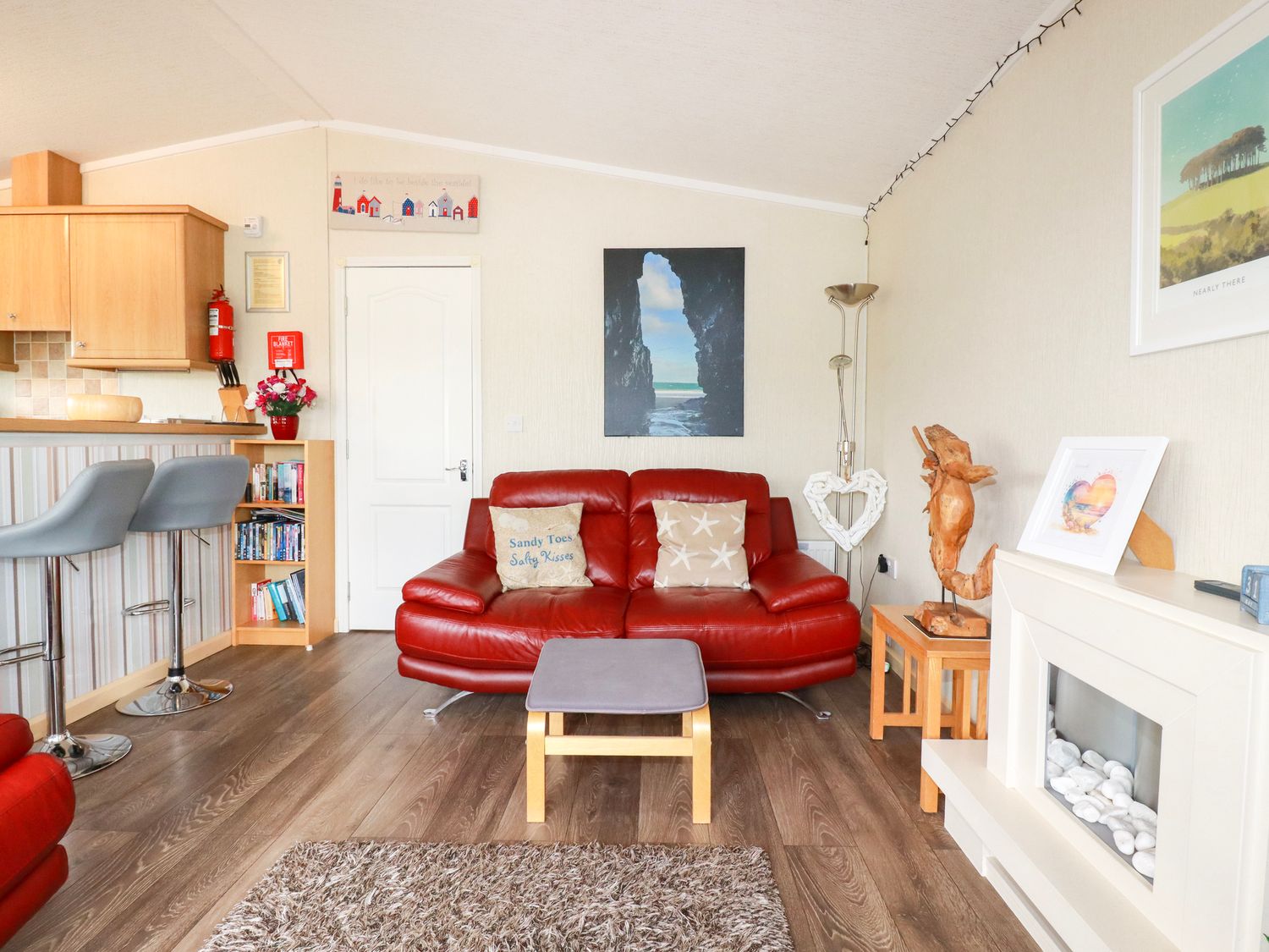 A living room with a sofa and coffee table at Chi Prenn Byhan in Tintagel