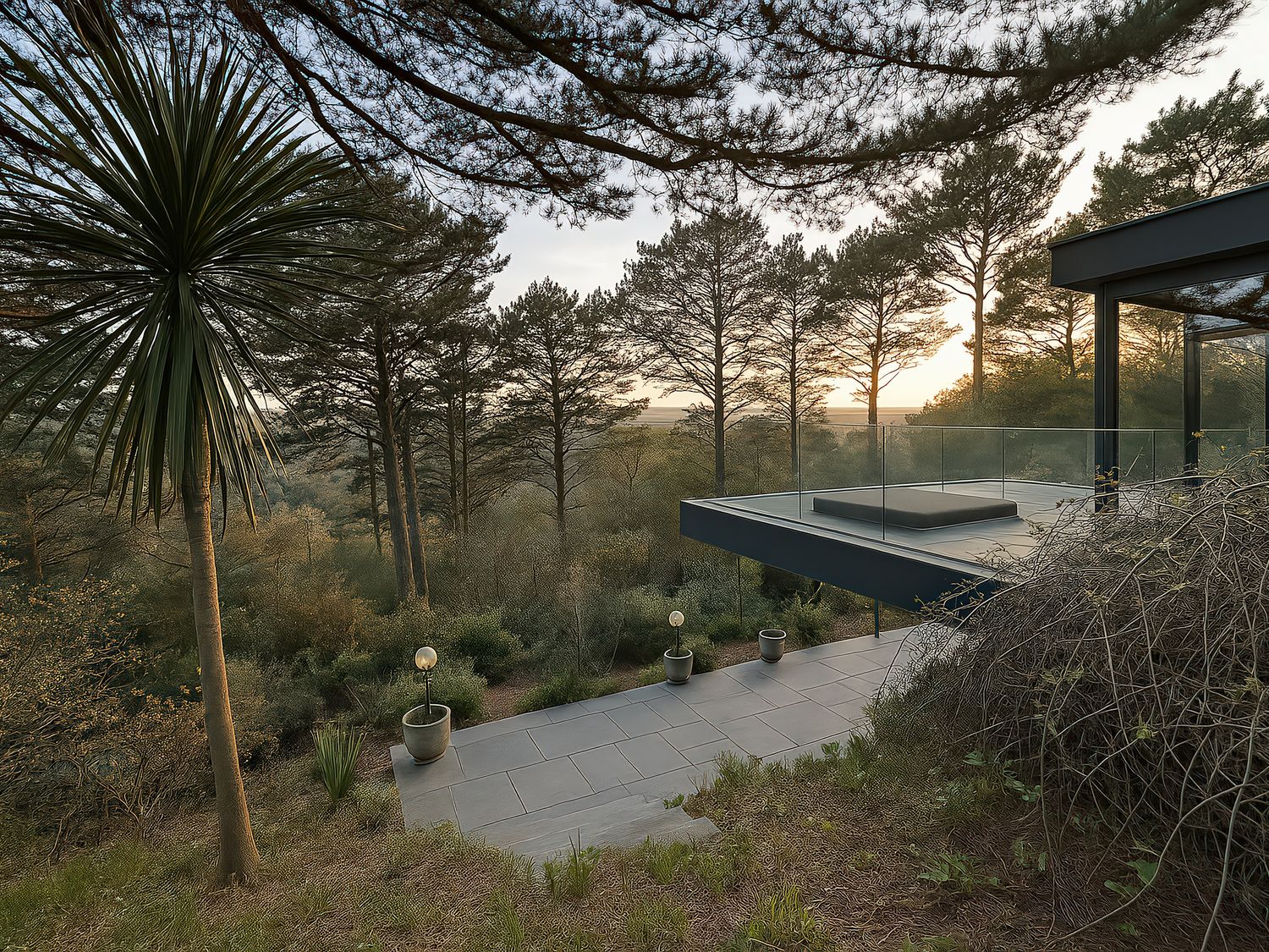 An outdoor seating area with trees and a platform at Landmark in Salcombe