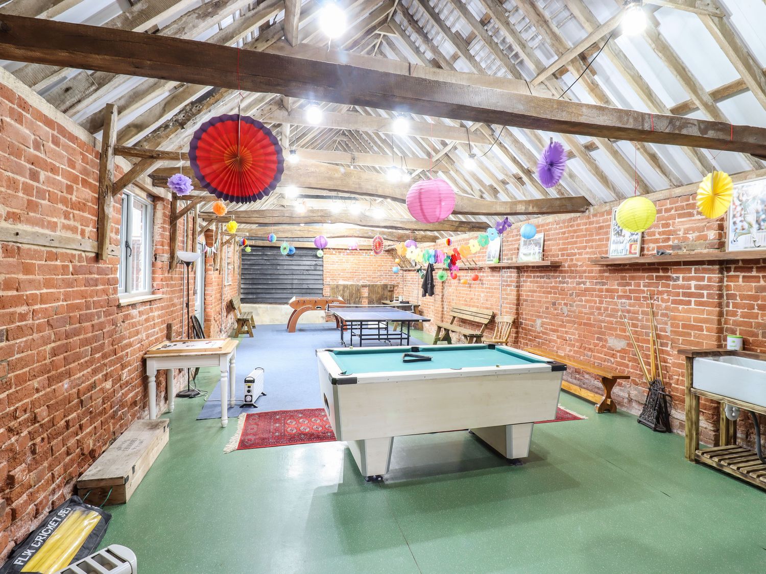 A games room with a pool table table tennis and foosball table at The Stables in Polstead