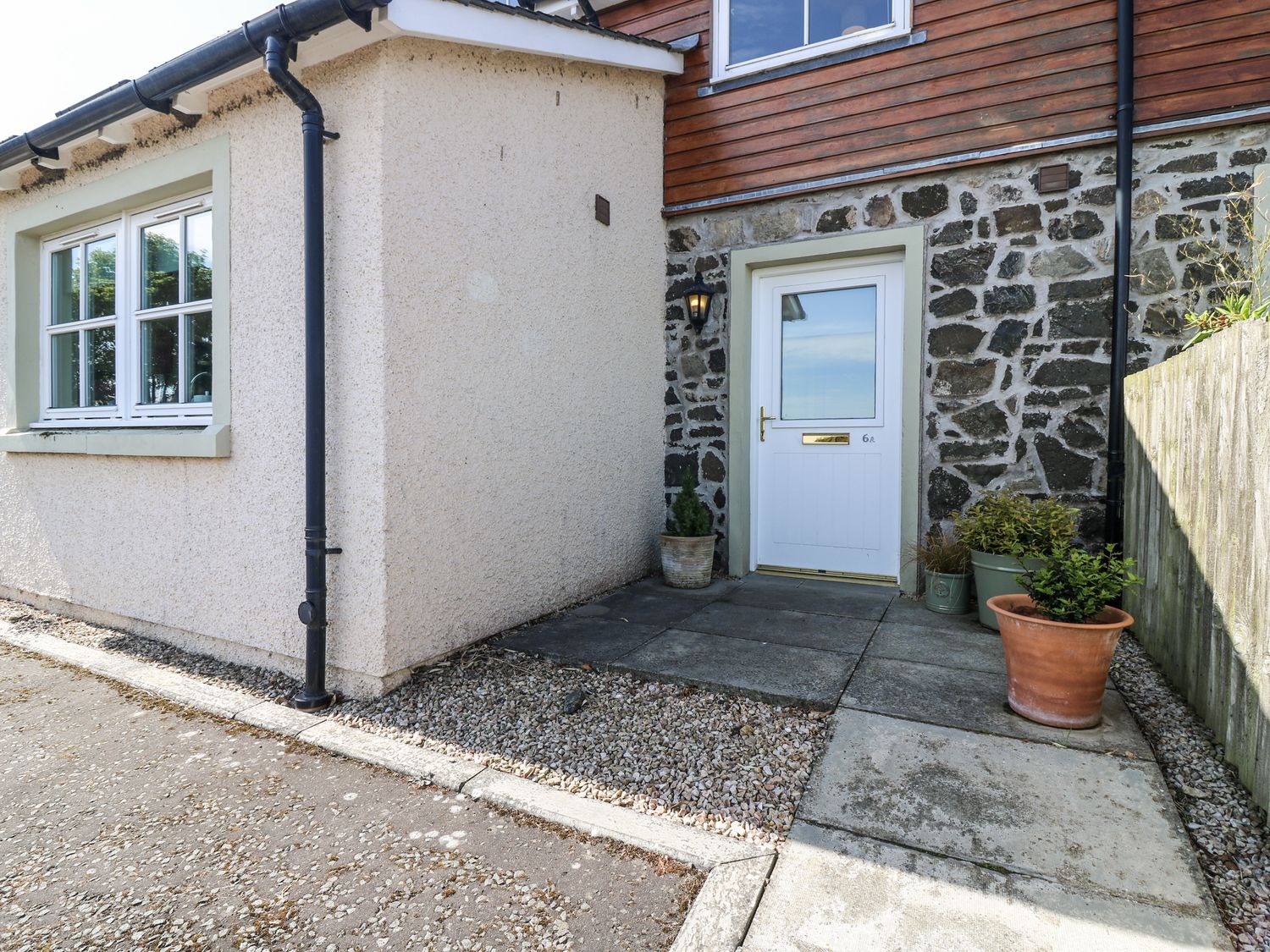 An entrance area with a door and window at 6A Pitlethie Steading Leuchars
