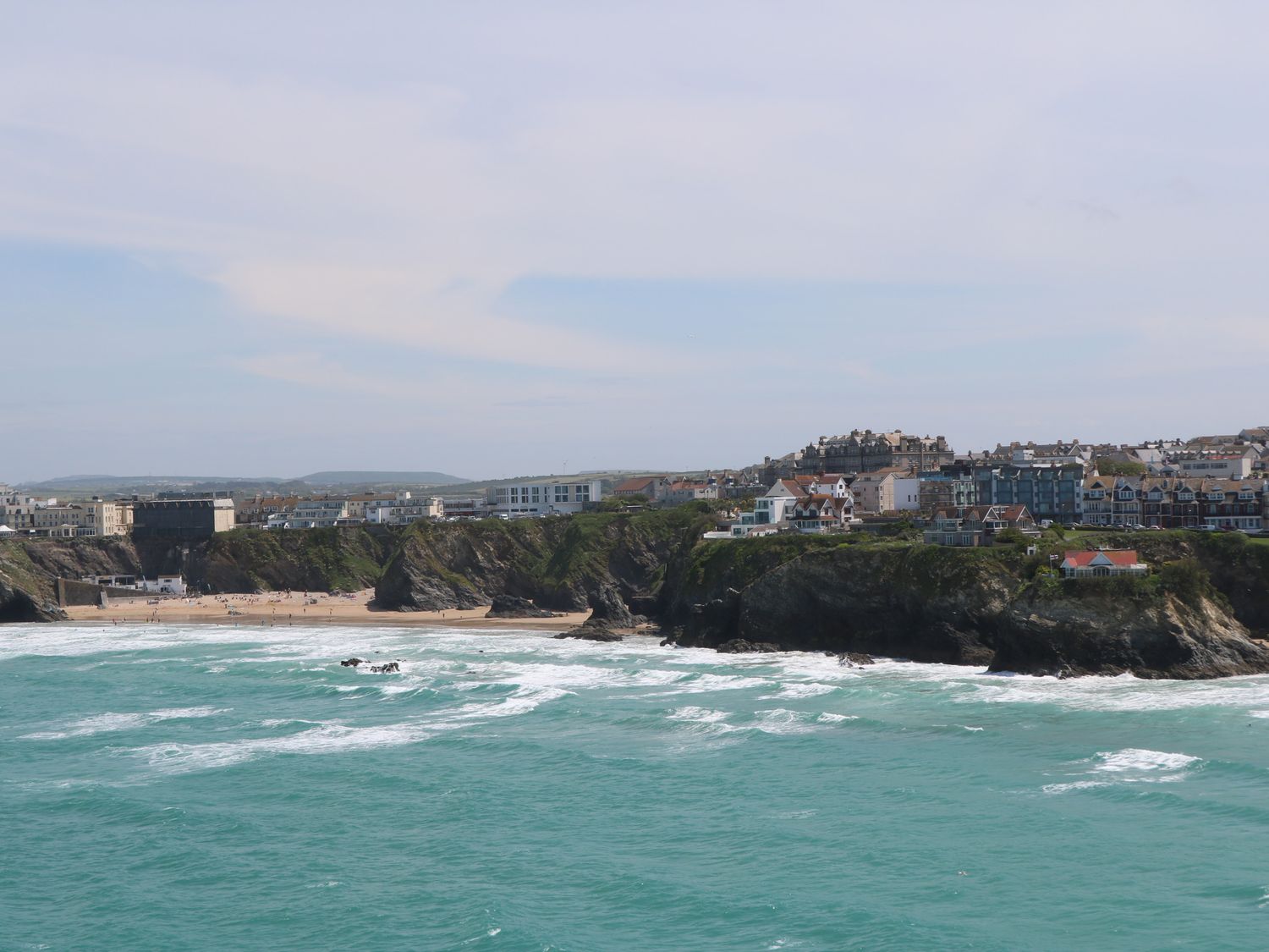 A coastal town with cliffs and buildings by the sea at Kimberley House in St Columb Minor