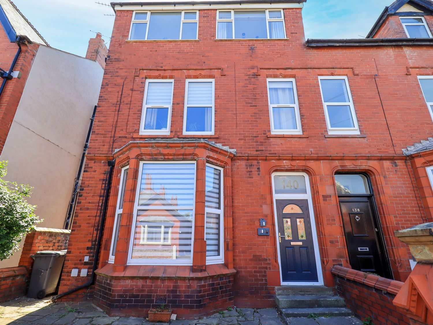 An exterior view of a brick building with windows and doors at The Nest in Lytham St. Annes