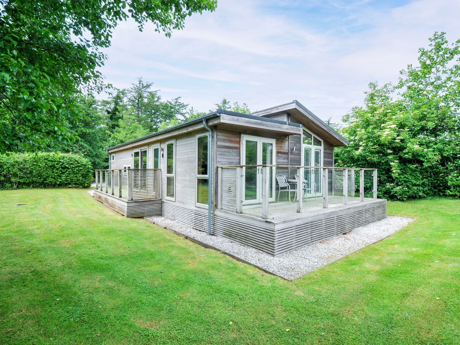 A house with a deck and glass railing in the outdoor area at 5 Faraway Fields Dobwalls