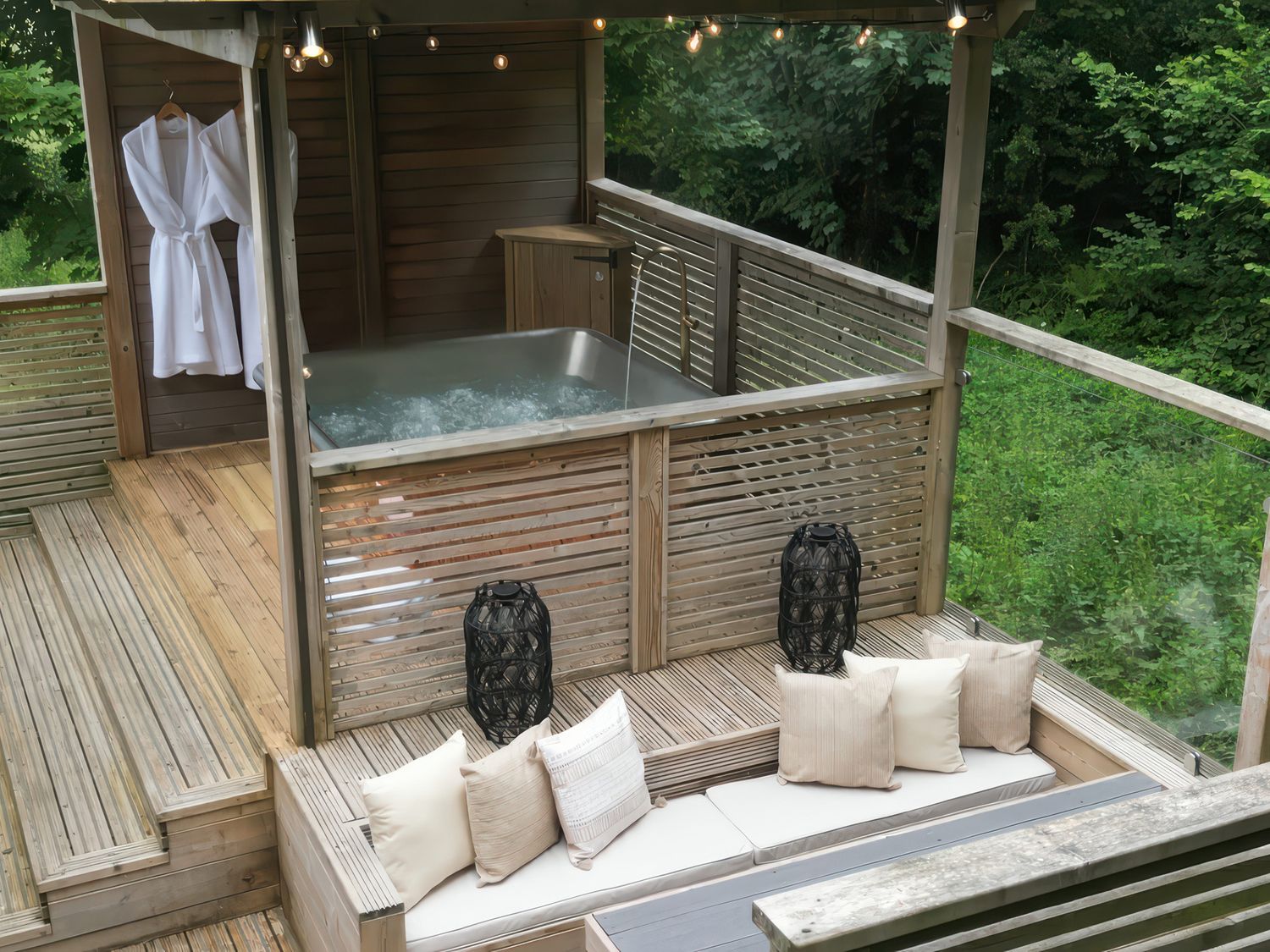 An outdoor area with a hot tub and wooden deck at 24 Meadow Retreat in Dobwalls