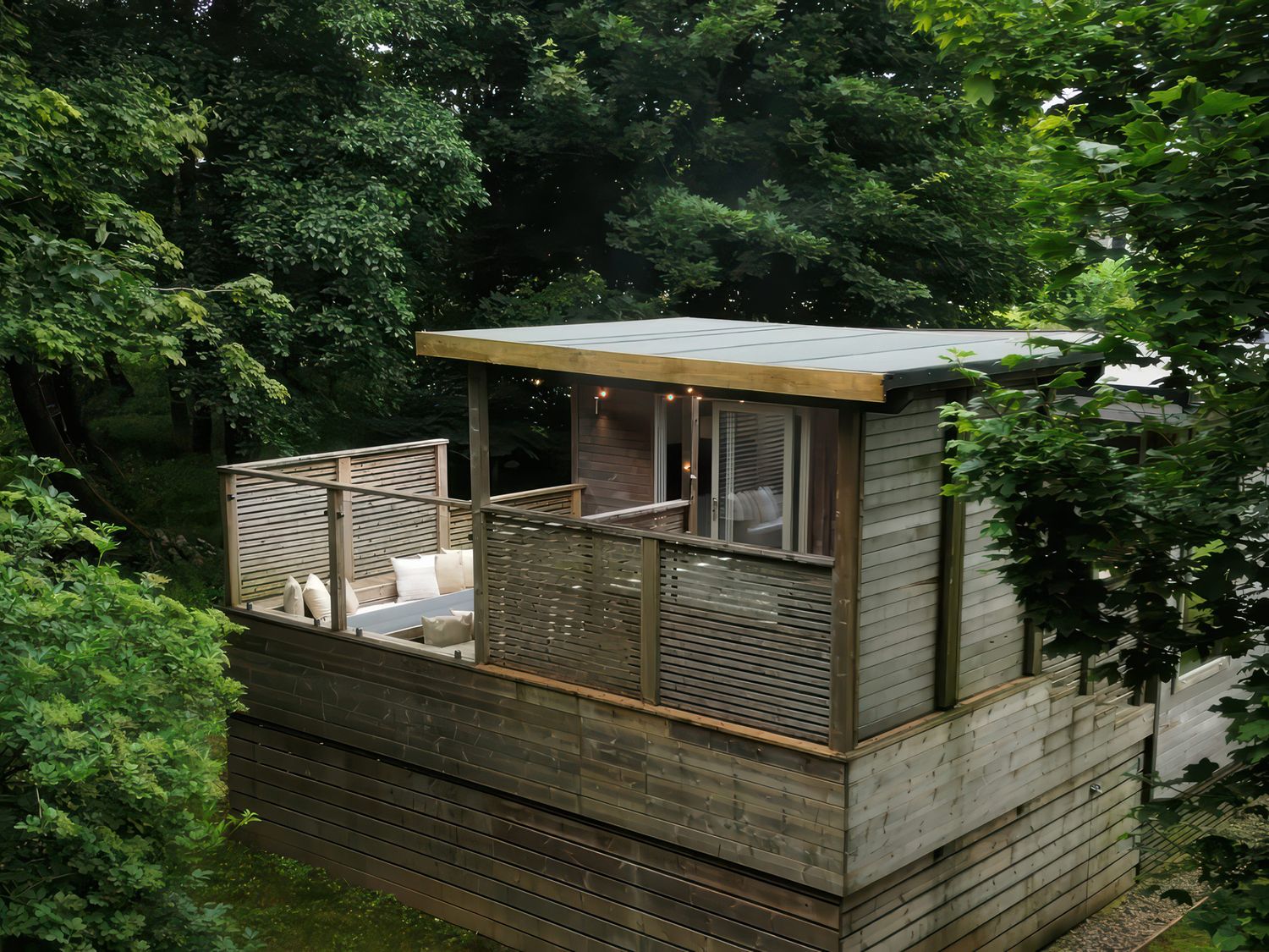 An outdoor area with seating and wooden railing at 24 Meadow Retreat in Dobwalls