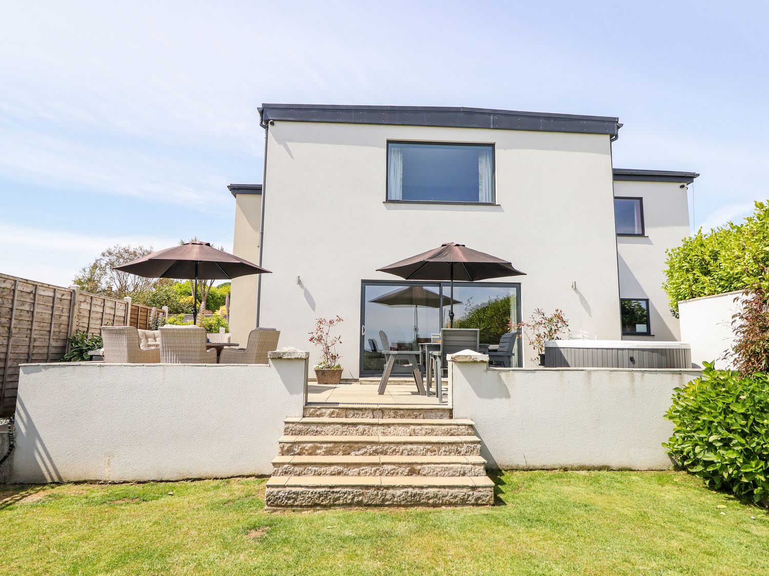 A house with a patio and garden at Bryn Mor in Benllech
