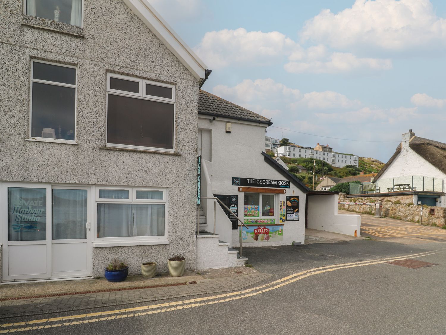 An outdoor view of an ice cream kiosk at Harbour Studio in Sennen Cove