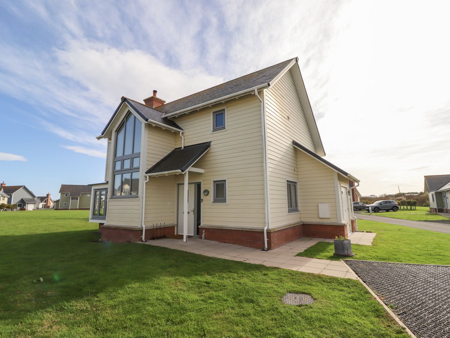 An exterior view of a house with a garden at The Beach House in Beadnell