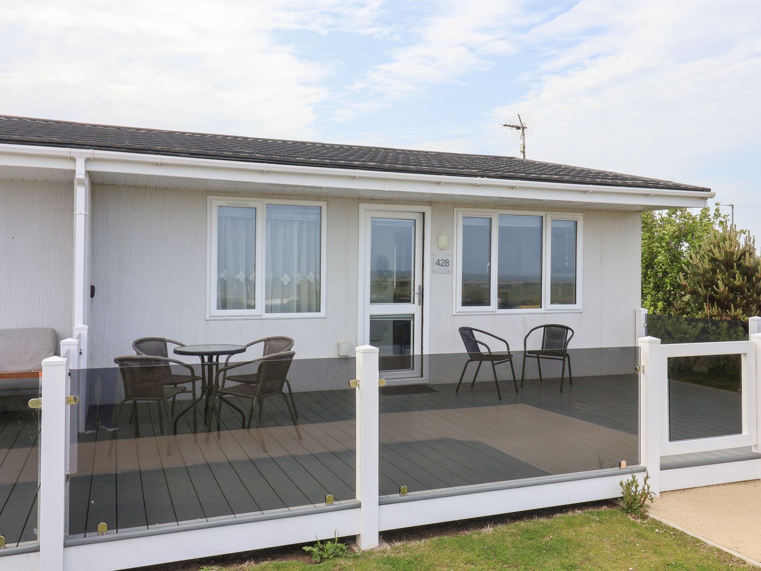 An outdoor area with a deck and seating at Bonny Bay in Wilsthorpe near Bridlington