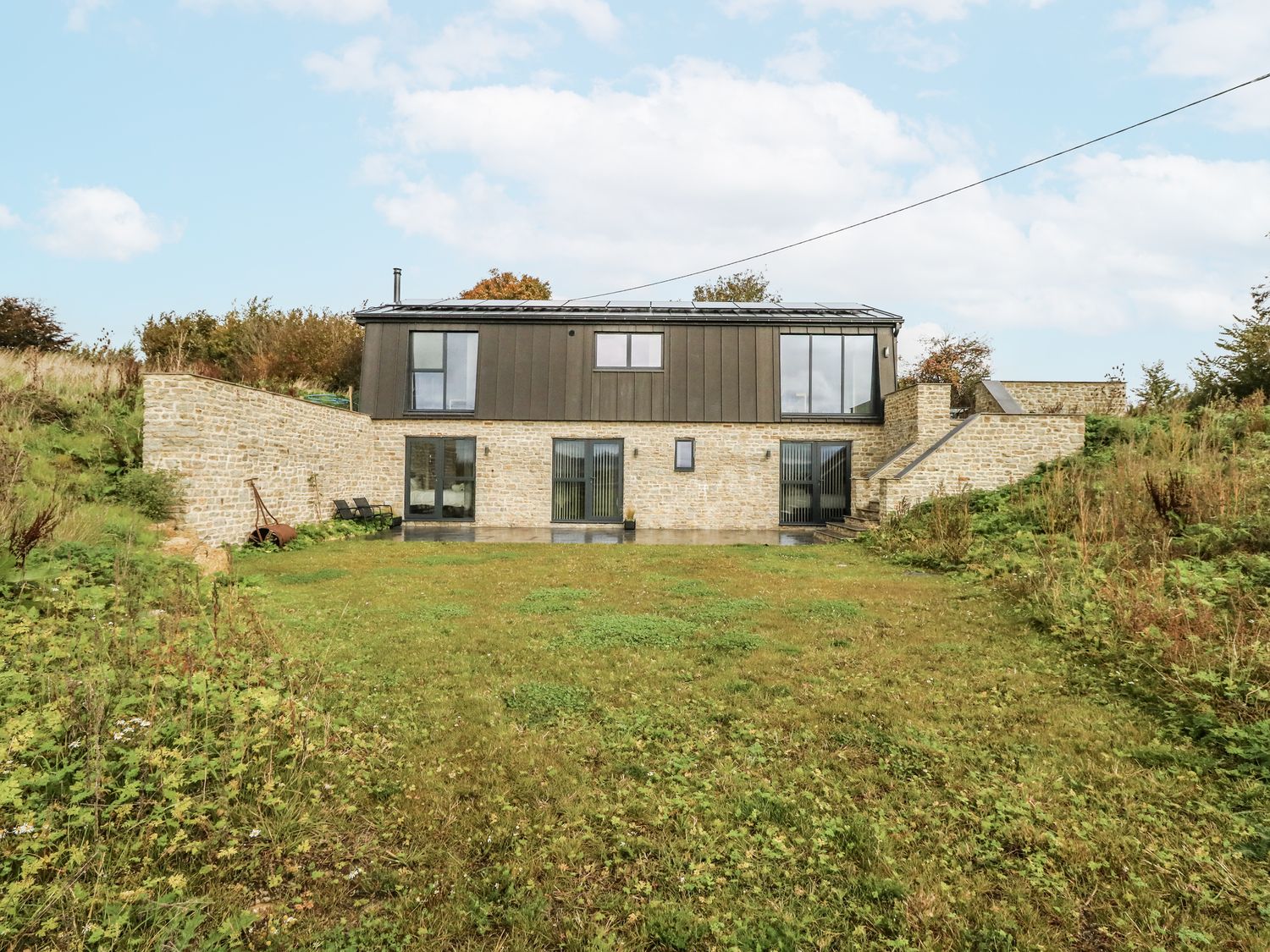 A house with grass and stairs at Frogwell in Yetminster