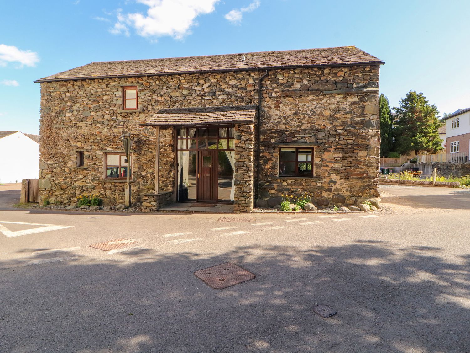 An exterior view of a stone building at Beck Edge in Braithwaite