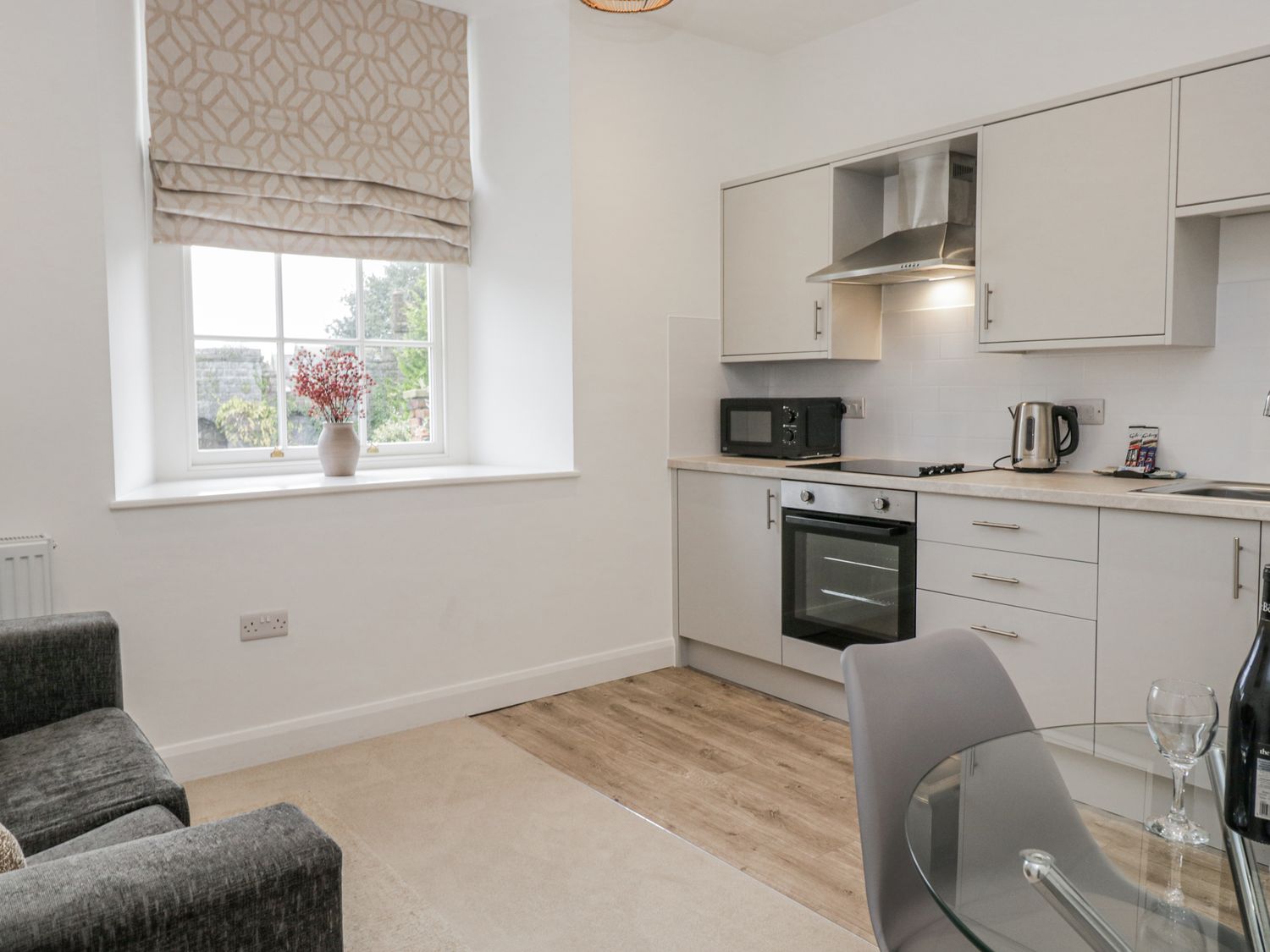 A kitchen with appliances and furniture at Ullswater in Ulverston
