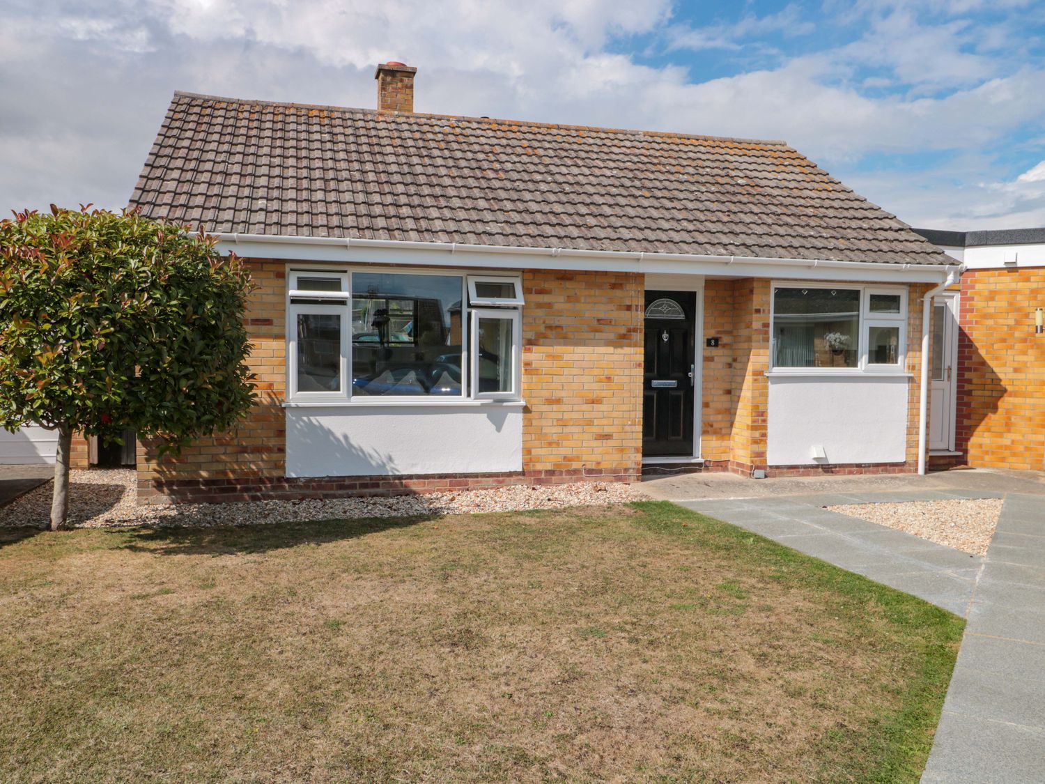 A house with a garden and pathway at No 8 Burnham-on-Sea