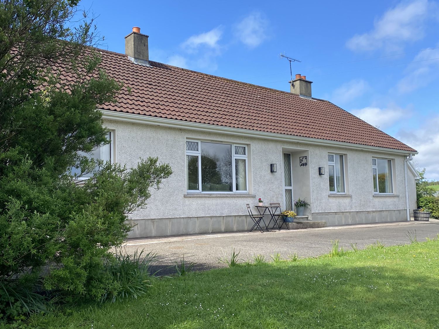 A house with windows and a door at Betty's Farm Cottage Lack near Ederney, County Fermanagh