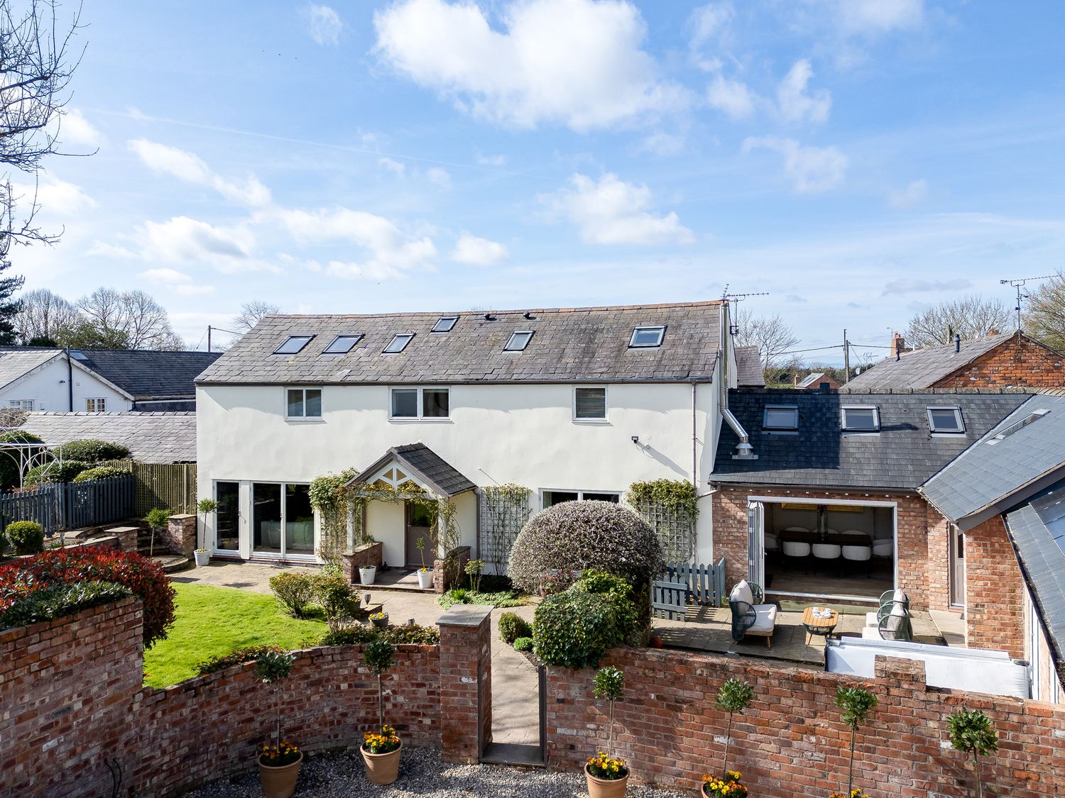 A house with a garden and potted plants at The Old Chase in Chester