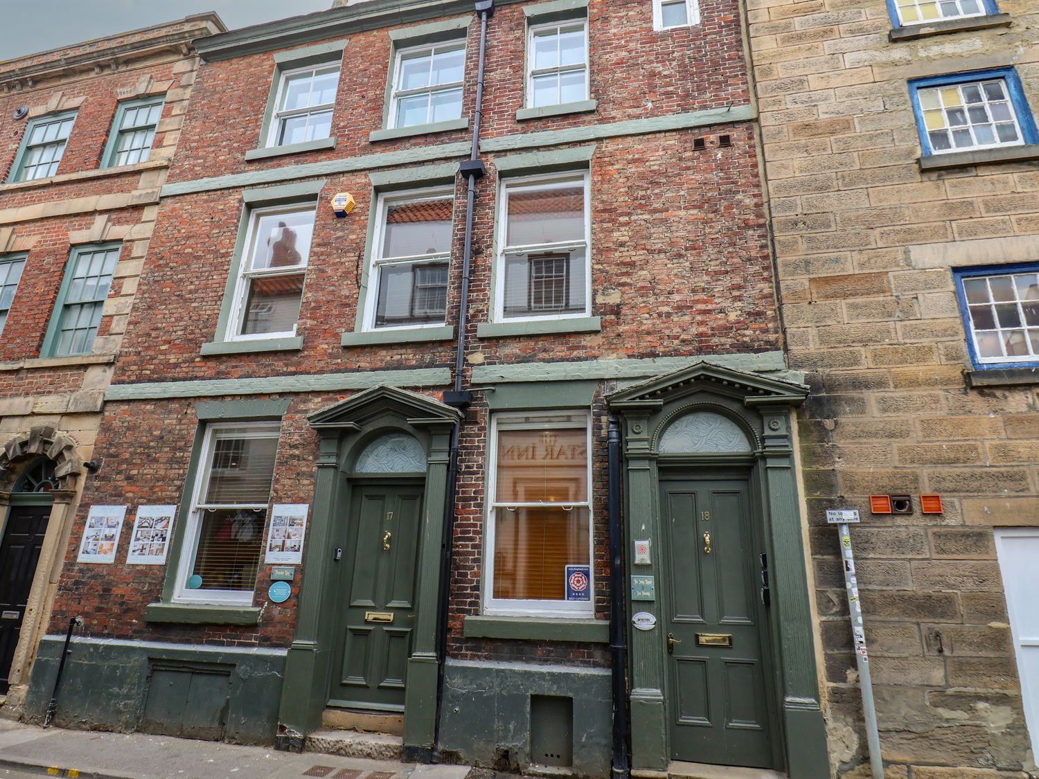A building facade with doors and windows at Jolly Roger in Whitby