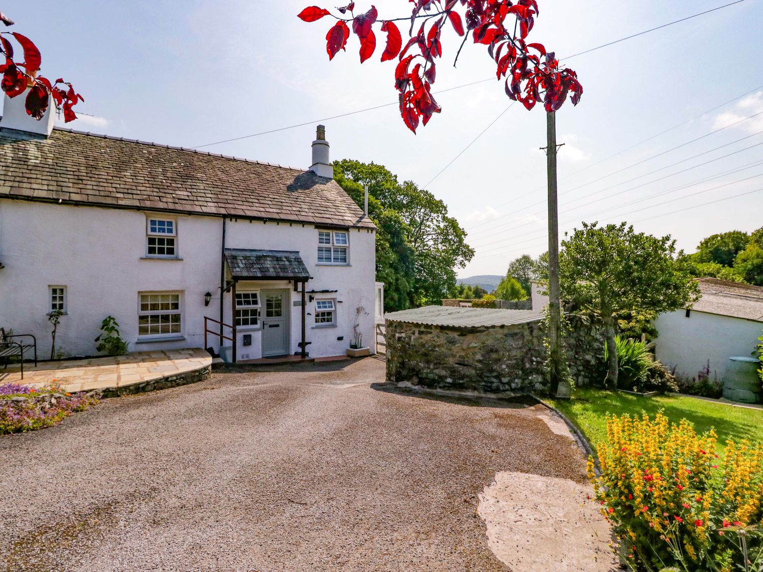 A house with garden and pathway at Burnbank Cottage in Grange-Over-Sands