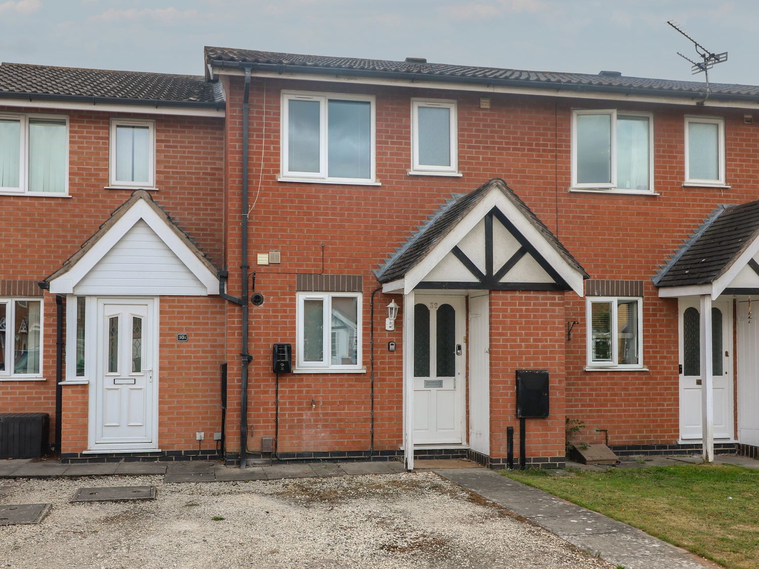 A residential exterior with doors and windows at 32 Moorland House Syston