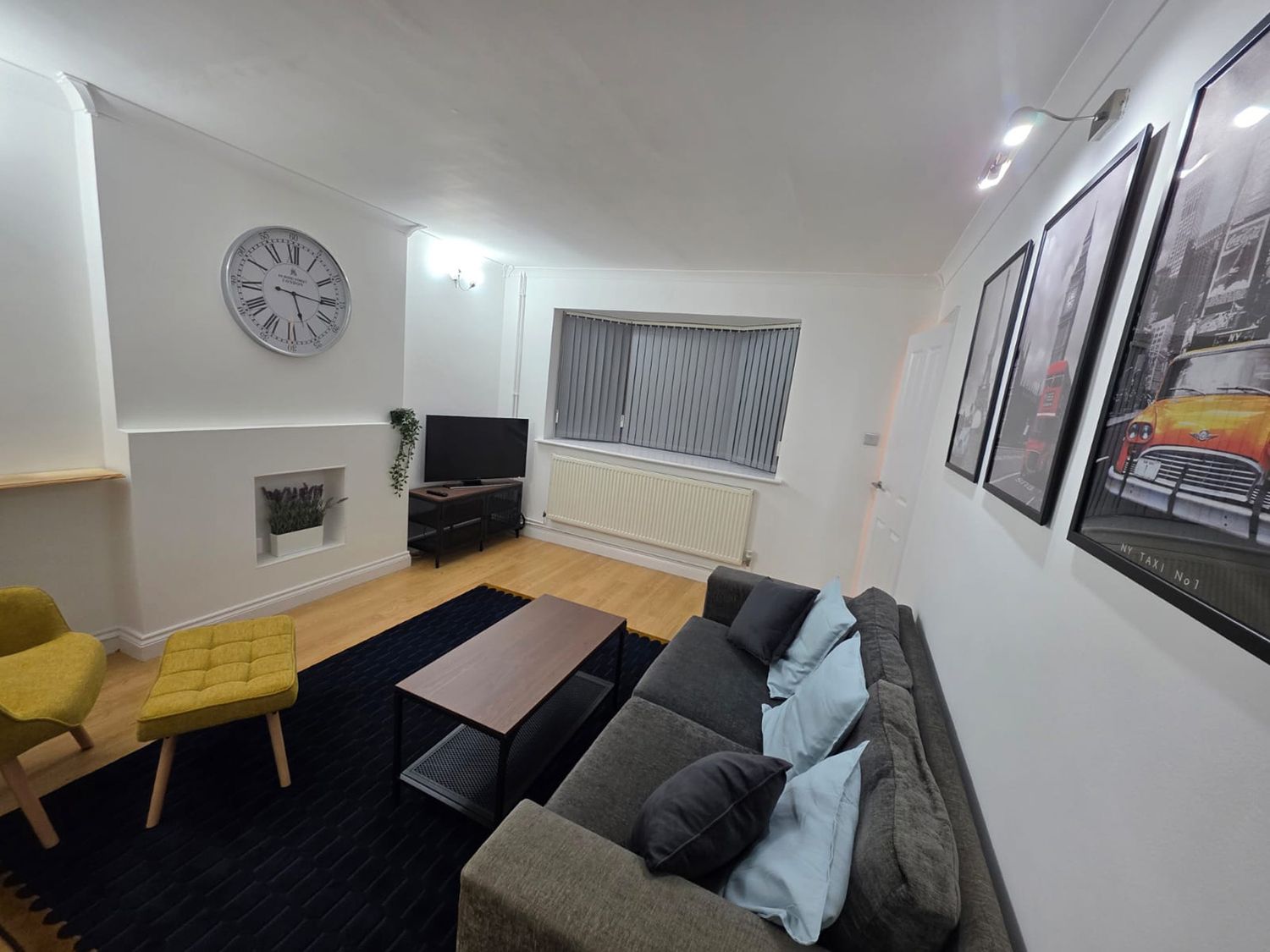 A living room with a sofa and coffee table at 12 Gorse Lane Leicester