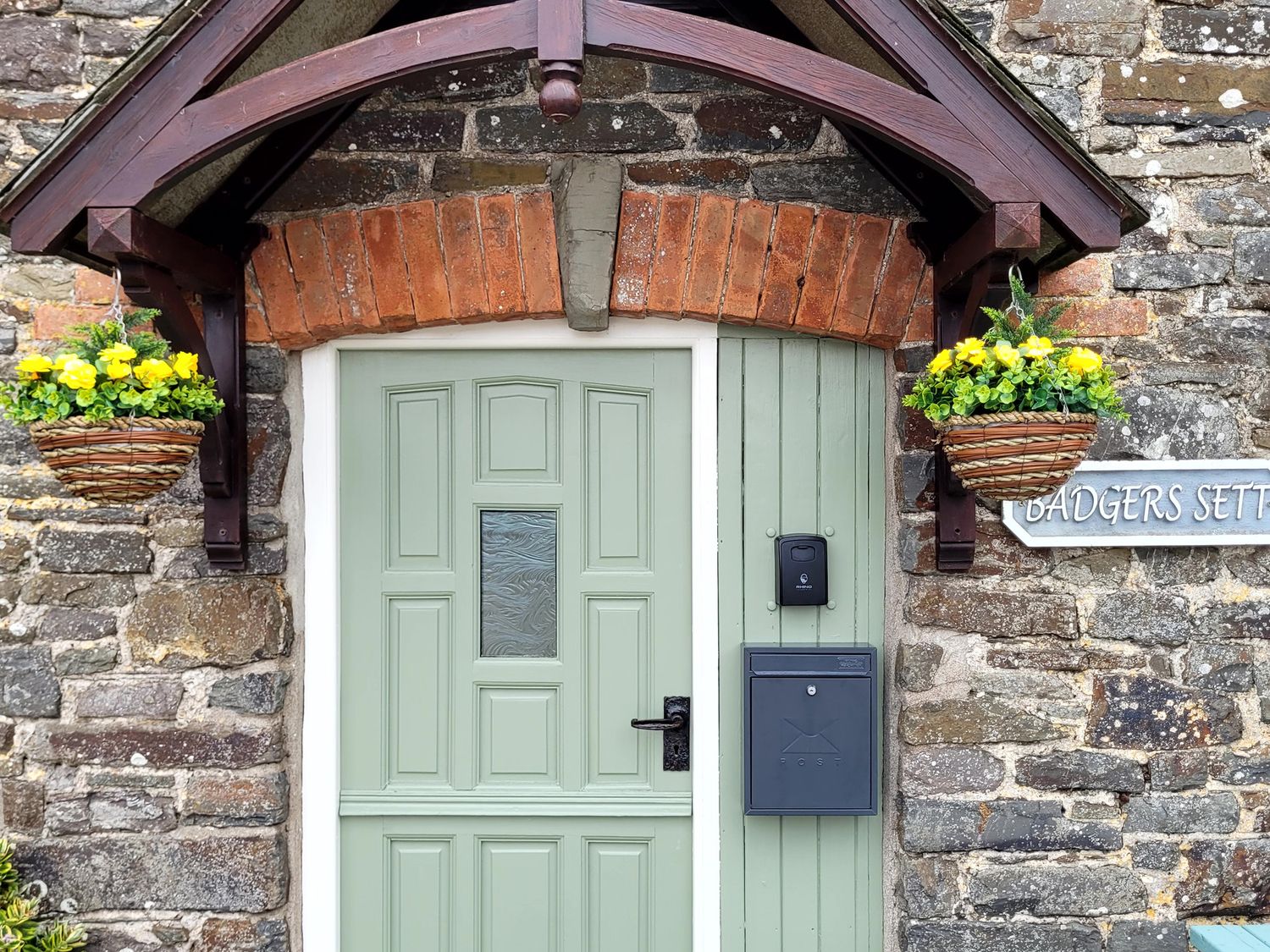 A front door and mailbox at Badgers Sett in Stibb near Kilkhampton