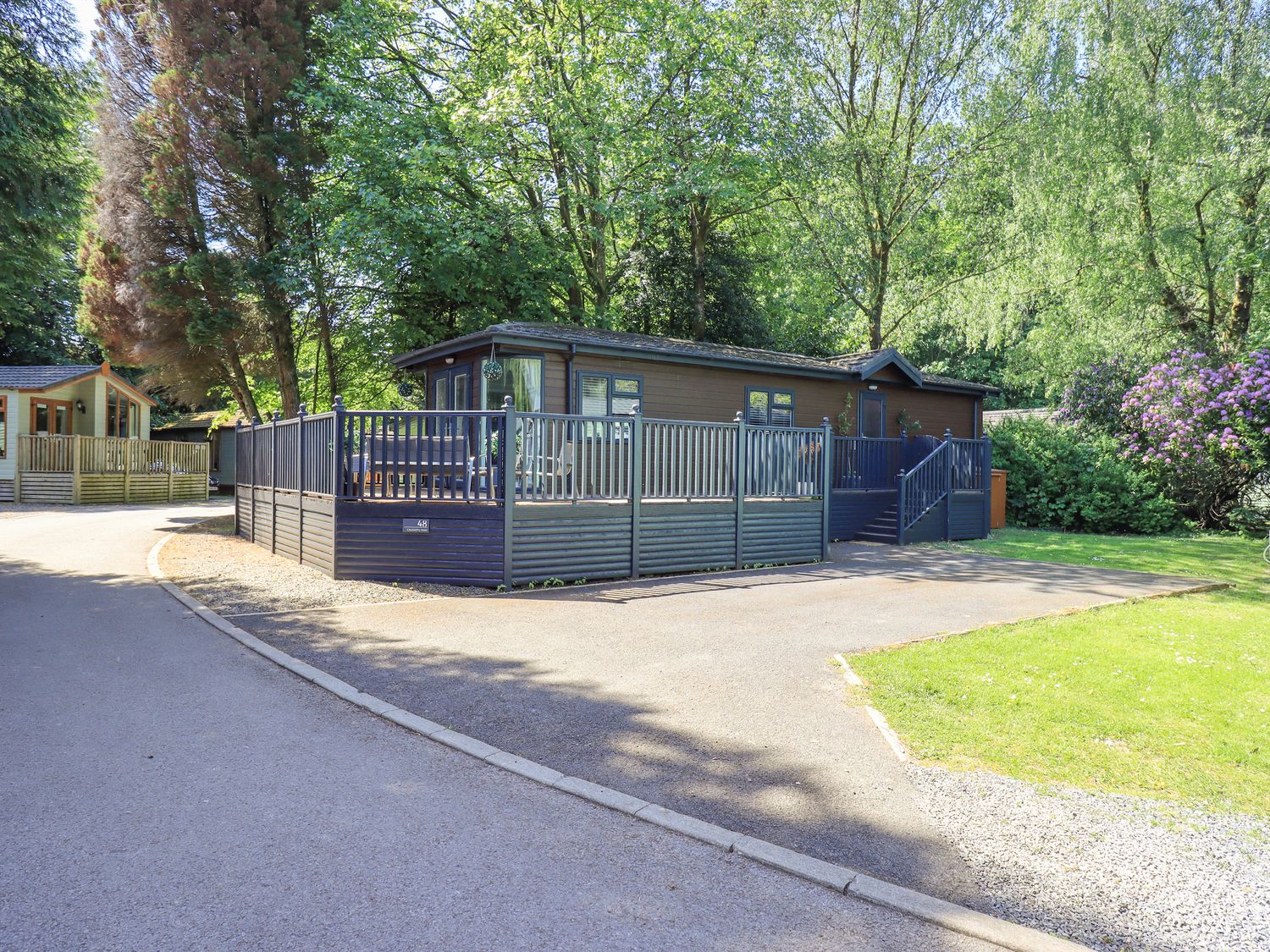 A house with a fenced area and steps at Evermore Lodge, 48 Calgarth Park, White Cross Bay, Windermere