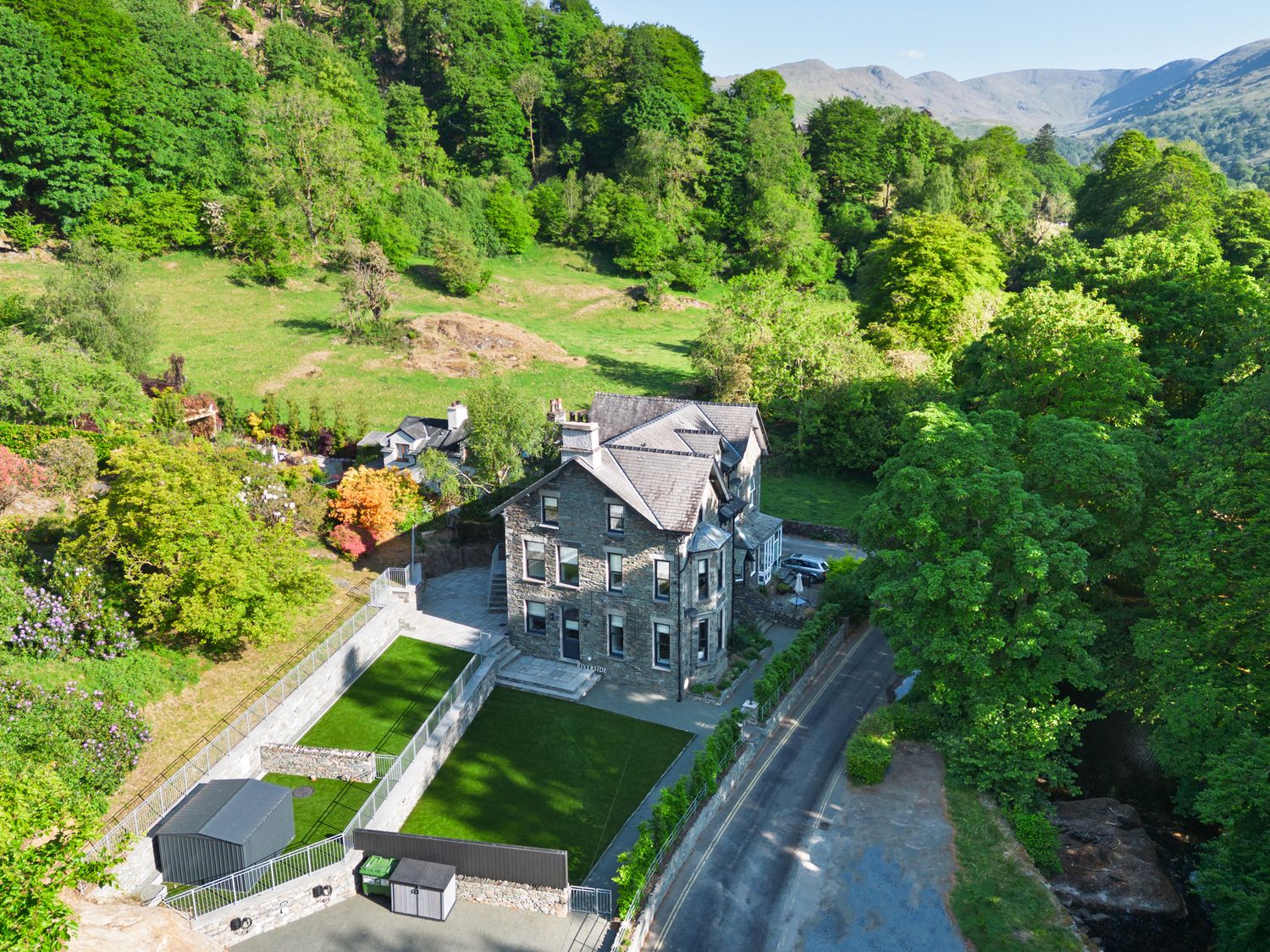 A house with garden and trees at Riverside in Ambleside