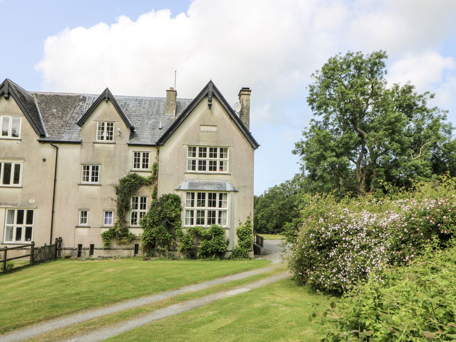 A house with windows and a pathway at Plas Pontfaen near Fishguard and Newport, Pembrokeshire
