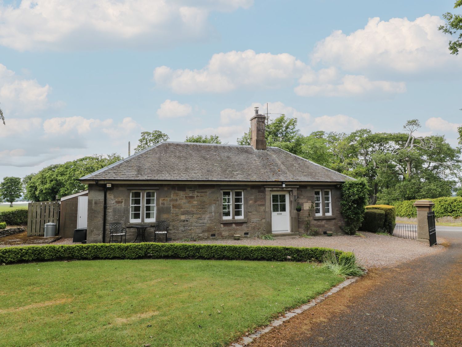 A house with a garden and driveway at Eagle Glen Cottage Kettins near Coupar Angus
