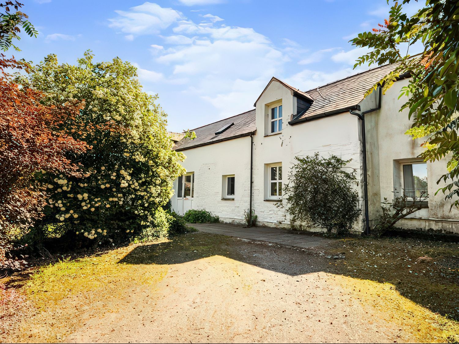 A house with a garden and pathway at The Steading in Castle Douglas