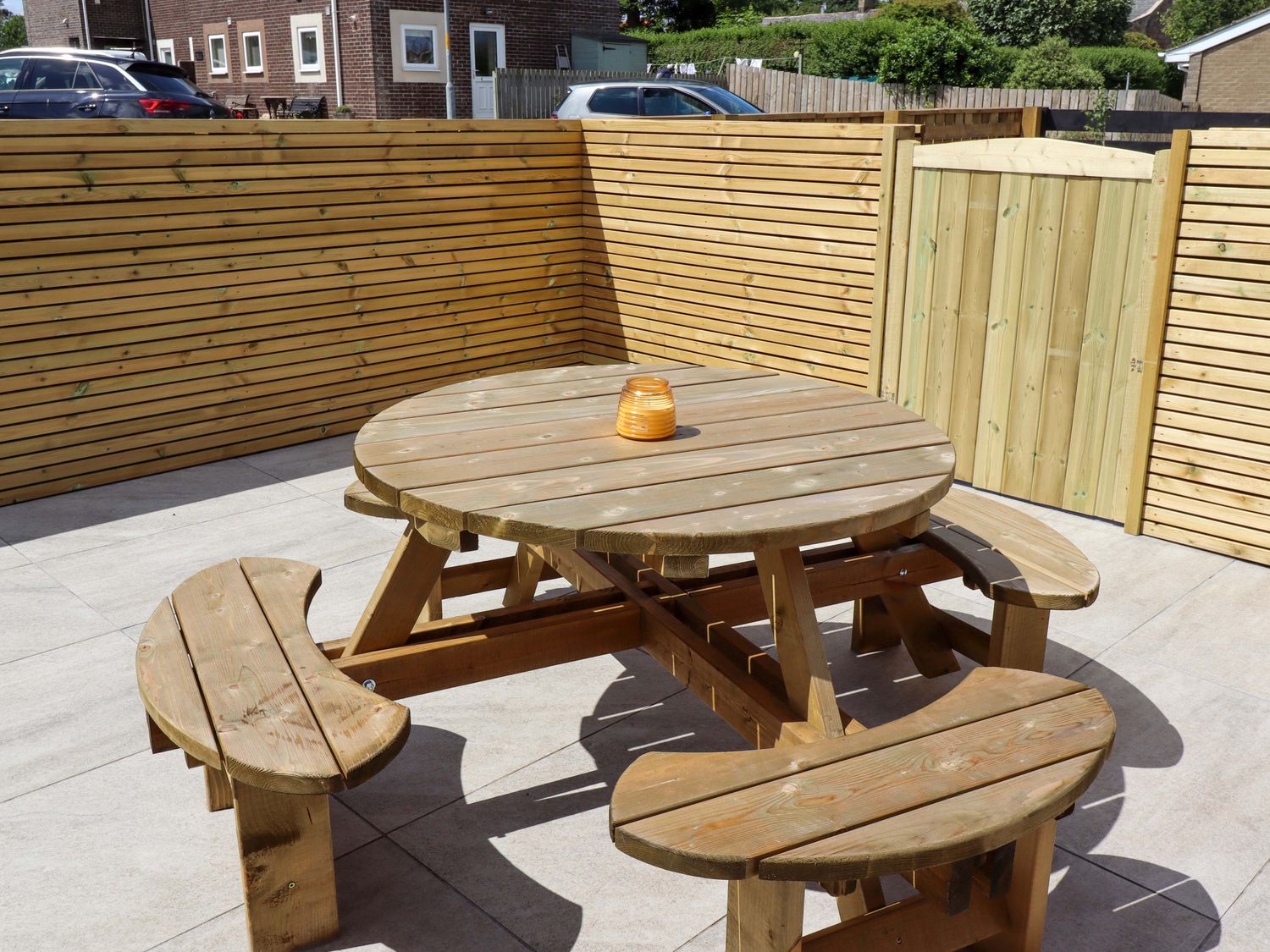 A table with benches in an outdoor area at North Sands Beadnell