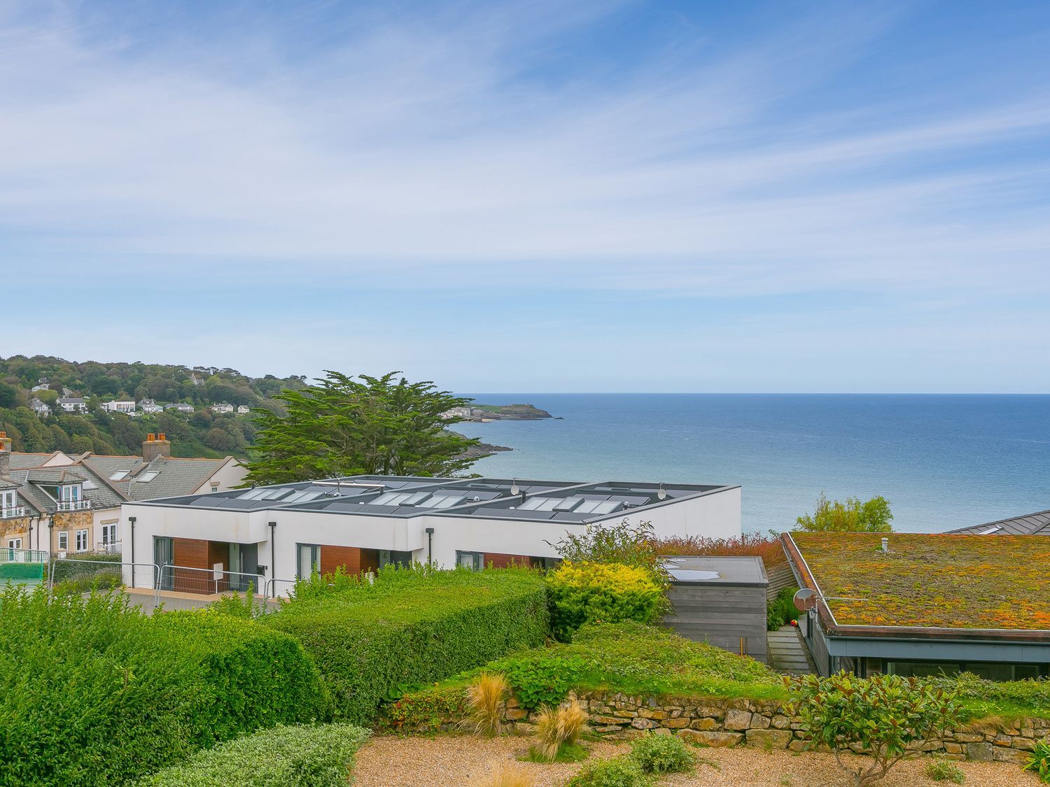An outdoor area with houses and sea view at Far Cliffs in St. Ives