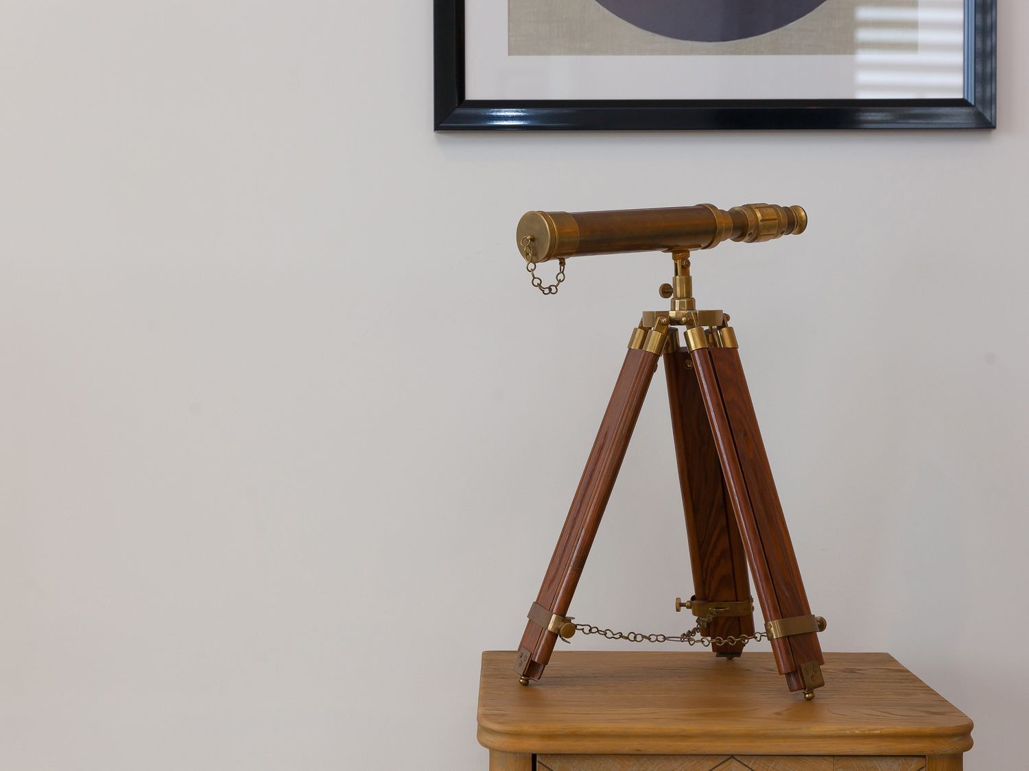 A telescope on a wooden table at Far Cliffs in St. Ives