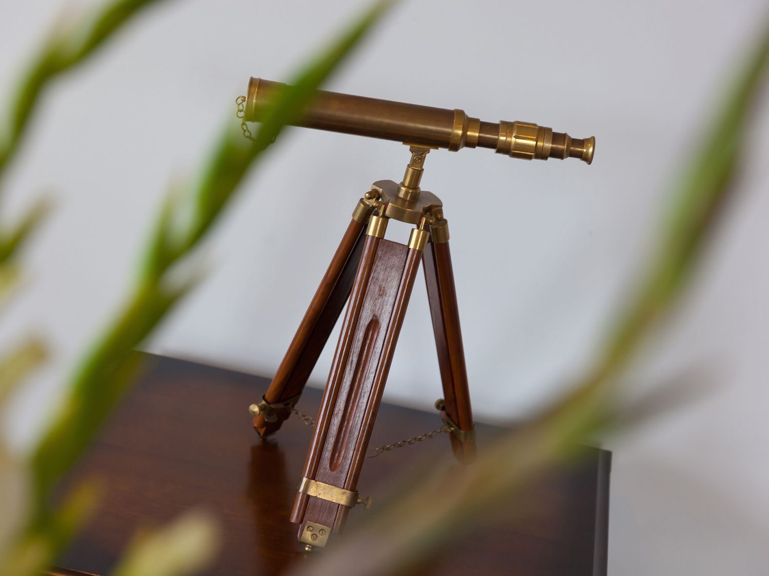 A telescope on a wooden tripod at Far Cliffs in St. Ives