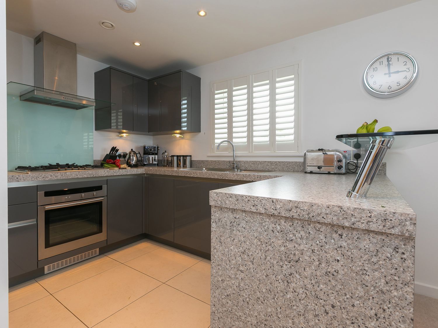 A kitchen with cabinets and appliances at Far Cliffs in St. Ives