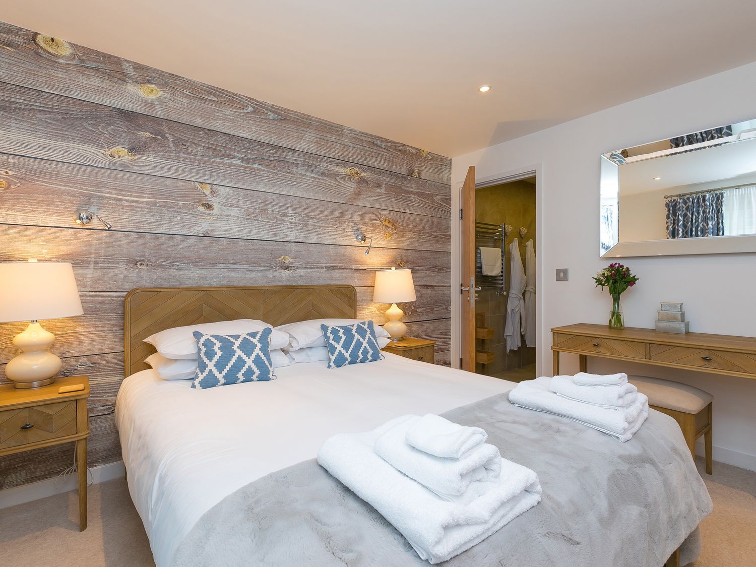 A bedroom with a double bed and bedside tables at Far Cliffs St. Ives
