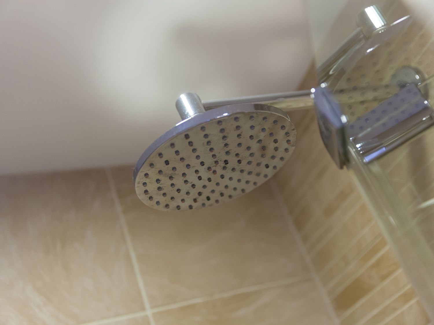 A shower head in a bathroom at Far Cliffs in St. Ives