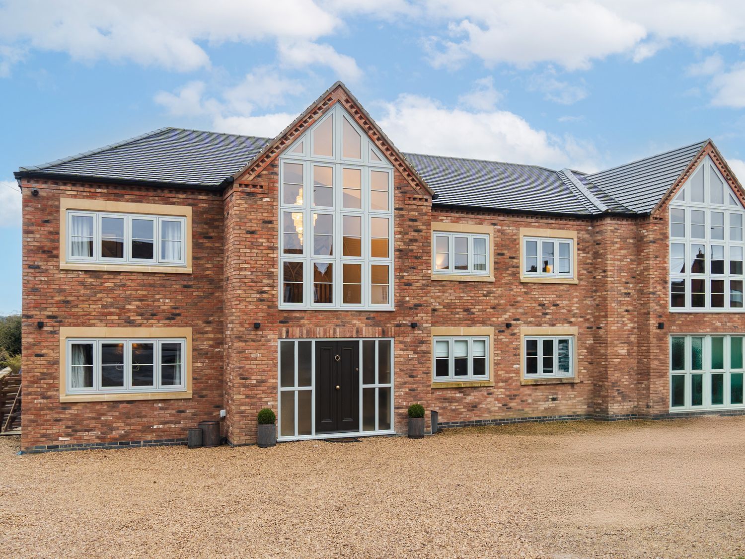 A brick house with multiple windows and a door at 30 High Lane East Ilkeston