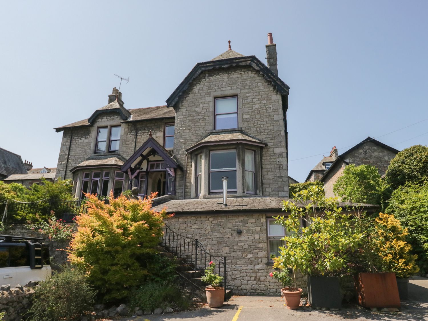 A house with a garden and steps at Lilac Cottage in Grange-Over-Sands