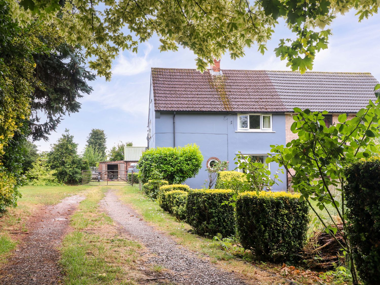 An outdoor area with a house and pathway at Oxcroft View in Oxcroft near Clowne