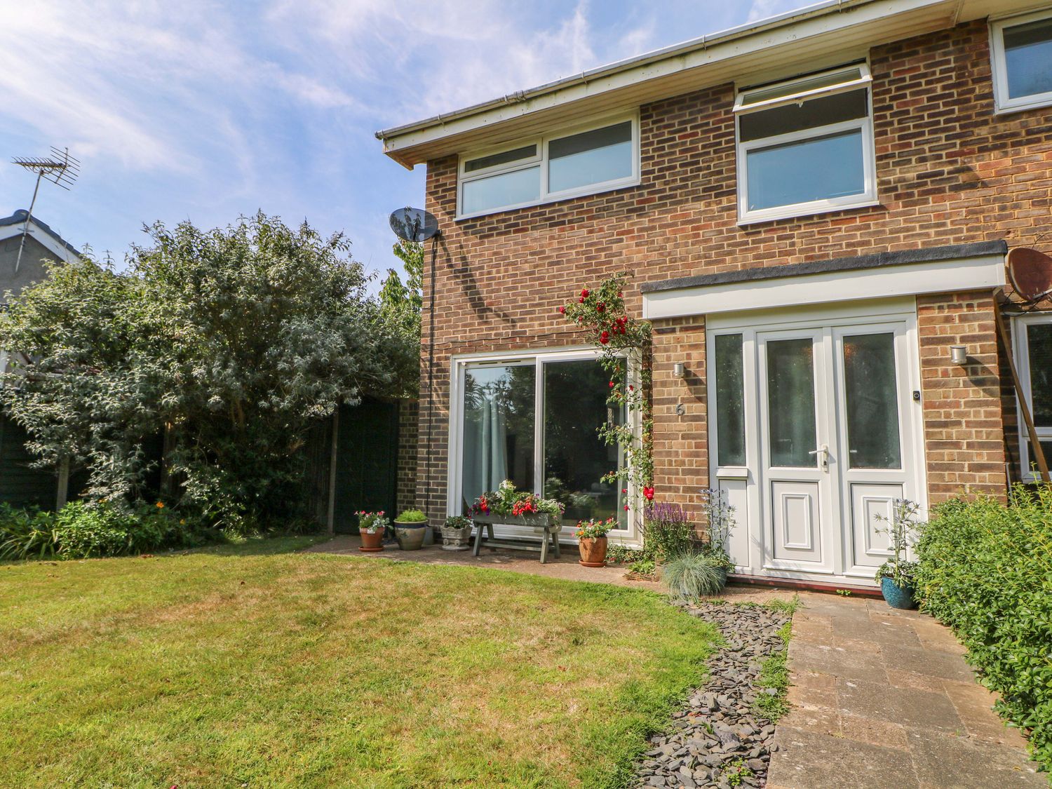 A house exterior with garden and pathway at 6 Ashton Gardens Rustington