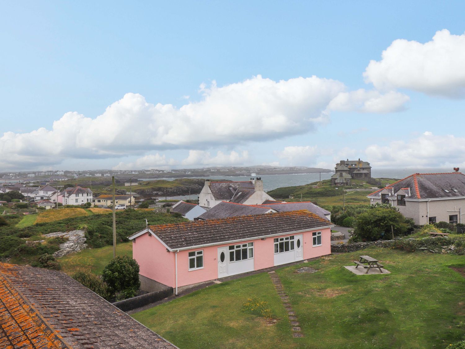 A view of houses and landscape at Sea Views No 8 Plas Darien Trearddur Bay