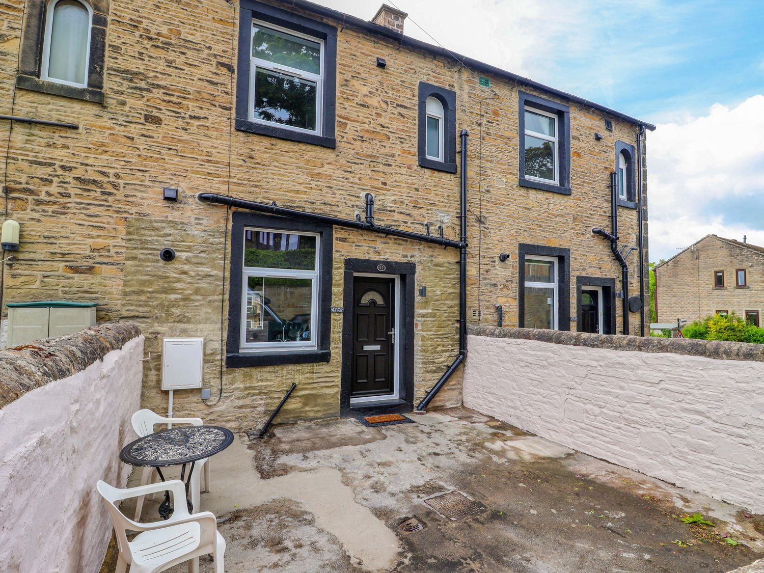 An outdoor area with a table and chairs at Canal View in Skipton